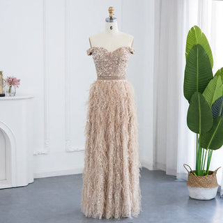 Golden Plume Elegance: Champagne Mermaid Evening Gown with Dubai-Inspired Feathers - Off-the-Shoulder Grandeur for Proms and Formal Events.