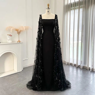 Midnight Blossom: Black Satin Arabic Gown with 3D Flowers and Elegant Mermaid Cape for Formal Events.