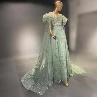 Ships in 1 to 3 Days – Minted Elegance: Dubai-Inspired Evening Gown in Mint Green with Feathered Cape Sleeve - The Epitome of Arabic Grace for Weddings and Formal Soirees.