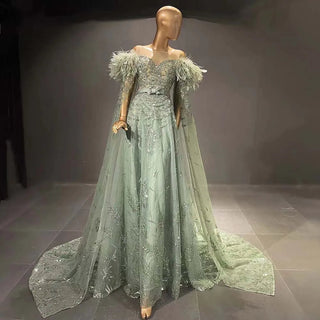 Ships in 1 to 3 Days – Minted Elegance: Dubai-Inspired Evening Gown in Mint Green with Feathered Cape Sleeve - The Epitome of Arabic Grace for Weddings and Formal Soirees.