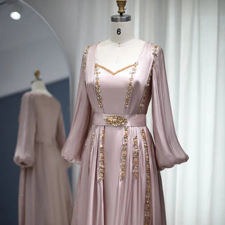 Moroccan Majesty: Rose Gold Kaftan Evening Dress with Long Sleeves - Dubai-Inspired Elegance for Muslim Weddings, Engagements, and Formal Affairs.