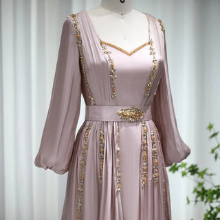 Moroccan Majesty: Rose Gold Kaftan Evening Dress with Long Sleeves - Dubai-Inspired Elegance for Muslim Weddings, Engagements, and Formal Affairs.