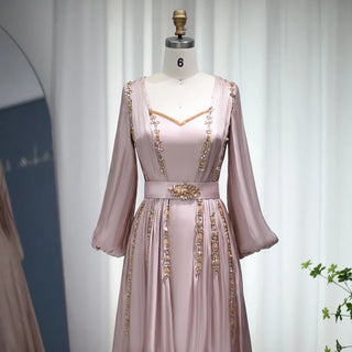 Moroccan Majesty: Rose Gold Kaftan Evening Dress with Long Sleeves - Dubai-Inspired Elegance for Muslim Weddings, Engagements, and Formal Affairs.