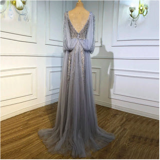 Silver Elegance: Dubai-Inspired Gray Evening Gown with Cape Sleeves - A Long Tulle Stunner for Elegant Arabic Weddings and Formal Proms.