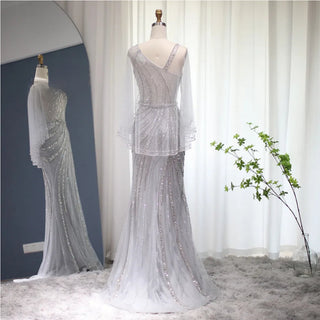 Champagne Elegance: Dubai-Inspired Mermaid Evening Gown with Silver Cape Accent - One-Shoulder Wonder for Proms, Weddings, and Grand Soirees.