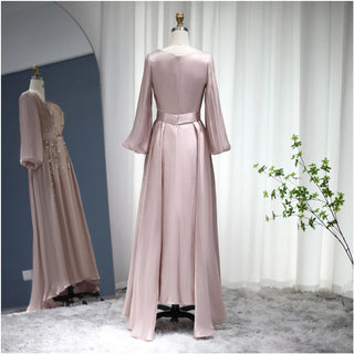 Moroccan Majesty: Rose Gold Kaftan Evening Dress with Long Sleeves - Dubai-Inspired Elegance for Muslim Weddings, Engagements, and Formal Affairs.