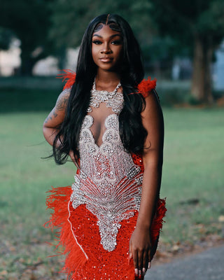 Opulent Red Feather and Sequin Embellished Gown with Intricate Beading