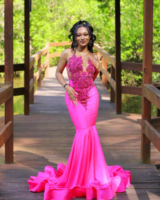 Elegant Pink Mermaid Gown with Intricate Appliques and Flowing Train