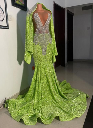 Dazzling Embellished Mermaid Gown with Sheer Bodice & Flowing Cape.