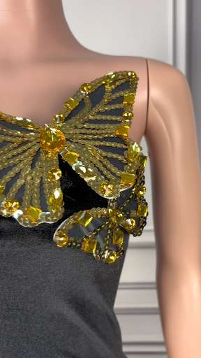 Elegant Black Strapless Gown with Gold Butterfly Embellishments