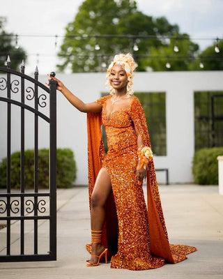 Show-Stopping Orange Sequin Gown with High Slit and Flowing Cape