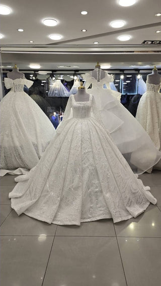 Elegant Crystal Embellished Bridal Ball Gown with Luxurious Train