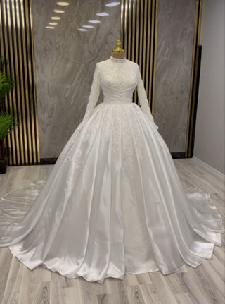 Radiant Pearl White Ball Gown with Sequin Embellished Bodice and Elegant Long Sleeves