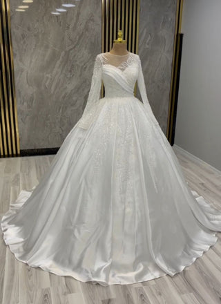 Luminous Elegance Bridal Gown with Beaded Accents and Draped Sleeves