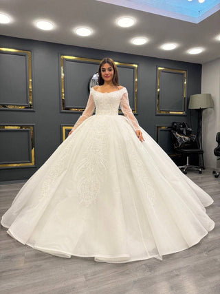 Enchanted Princess Bridal Gown with Off-Shoulder Sheer Sleeves and Gleaming Beadwork