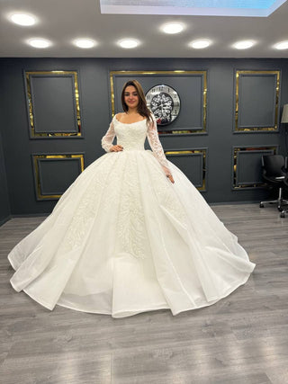 Lavish Beaded Off-Shoulder Wedding Gown with Sheer Sleeves and Grand Train