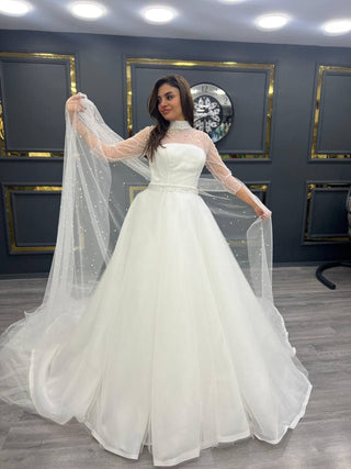 Timeless Satin Bridal Gown with Pearl-Embellished Sheer Sleeves and Elegant Train