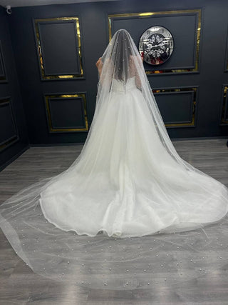 Timeless Satin Bridal Gown with Pearl-Embellished Sheer Sleeves and Elegant Train