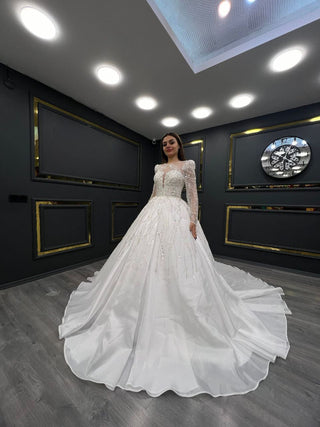 Radiant Illusion Neckline Beaded Ball Gown with Long Sleeves and Cascading Tulle Skirt