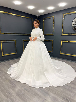 Regal High-Neck Beaded Ball Gown with Long Sleeves and Full Satin Skirt