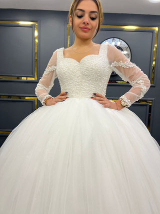 Graceful Sweetheart Neckline Beaded Ball Gown with Sheer Long Sleeves and Tulle Skirt