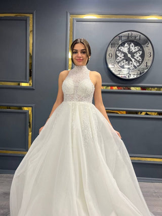 Enchanting High Neck Beaded Ball Gown with Intricate Illusion Bodice