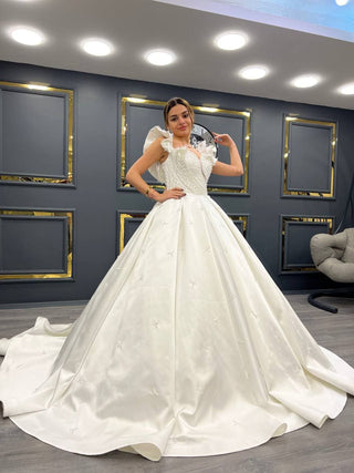 Majestic Pearl-Embellished Ball Gown with Ruffled Sleeves and Bow Detail