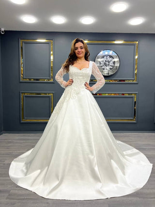 Elegant Long-Sleeve Satin Ball Gown with Intricate Beadwork and Lace Accents