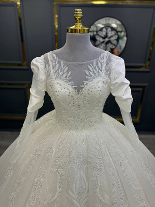 Enchanting Illusion Neckline Beaded Ball Gown with Ruched Sleeves and Lace Appliqué