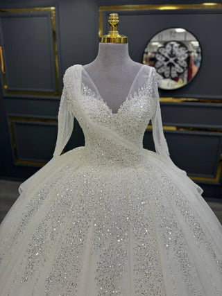 Extravagant Long-Sleeve Beaded Ball Gown with Crisscross Bodice and Glittering Embellishments