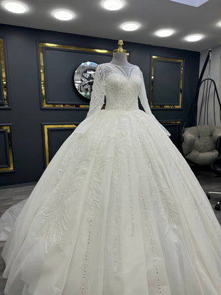 Elegant Beaded Illusion Neckline Ball Gown with Lace Appliqué and Flowing Sleeves