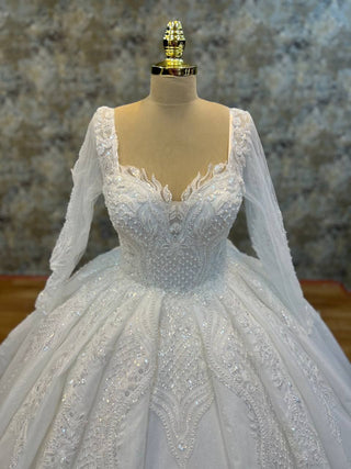 Magnificent Embroidered Ball Gown with Intricate Beaded Bodice and Regal Long Sleeves