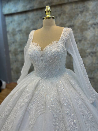 Magnificent Embroidered Ball Gown with Intricate Beaded Bodice and Regal Long Sleeves