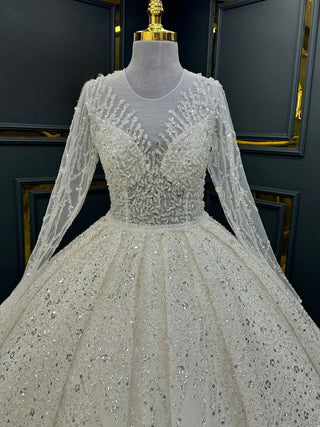 Opulent Beaded Illusion Ball Gown with Sheer Long Sleeves and Majestic Skirt