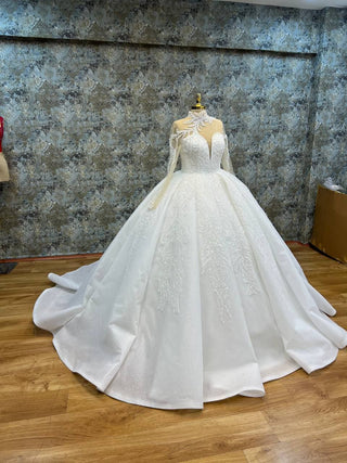 Luxurious Long-Sleeve Illusion High Neck Beaded Ball Gown with Dramatic Appliqué and Intricate Beading