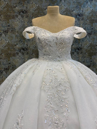 Opulent Off-Shoulder Beaded Ball Gown with Elaborate Embellishments and Regal Train