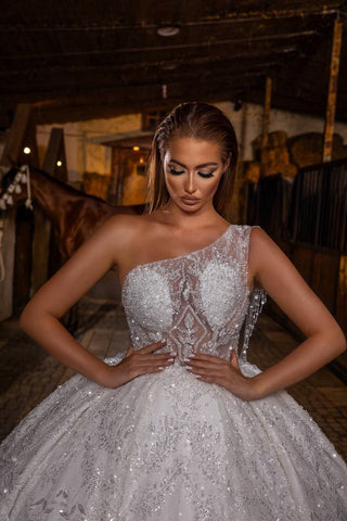 Luxurious One-Shoulder Ball Gown with Elaborate Beadwork, Sheer Bodice, and Embroidered Skirt