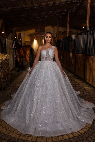 Luxurious One-Shoulder Ball Gown with Elaborate Beadwork, Sheer Bodice, and Embroidered Skirt