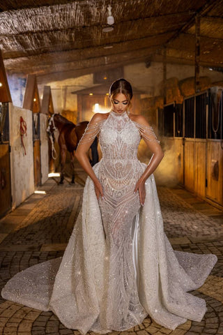 Extravagant High-Neck Sheer Mermaid Gown with Beaded Draped Sleeves and Detachable Train