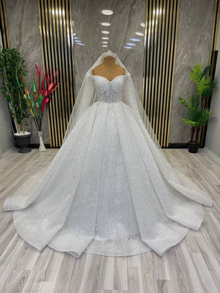 Exquisite Long-Sleeve Beaded Ball Gown with Illusion Sweetheart Neckline