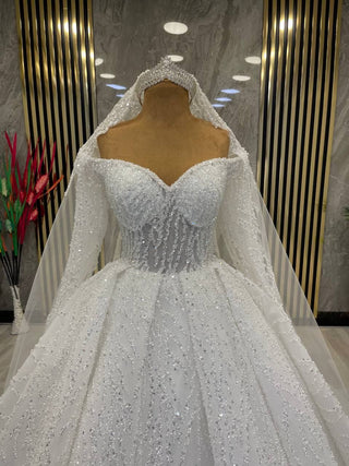 Exquisite Long-Sleeve Beaded Ball Gown with Illusion Sweetheart Neckline