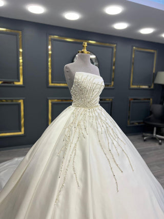 Sophisticated Strapless Beaded Satin Ball Gown with Intricate Embellishments and Grand Train