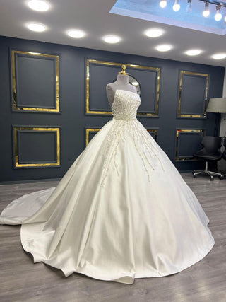 Sophisticated Strapless Beaded Satin Ball Gown with Intricate Embellishments and Grand Train