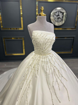 Sophisticated Strapless Beaded Satin Ball Gown with Intricate Embellishments and Grand Train