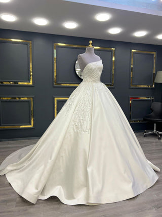 Opulent Off-Shoulder Beaded Satin Ball Gown with Cascading Embellishments and Grand Train