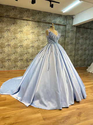 Enchanting Blue Ball Gown with Sparkling Beaded Details and Deep V-Neckline