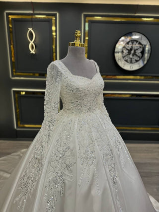 Ethereal Princess Wedding Gown with Sparkling Floral Embellishments and Elegant Sleeves