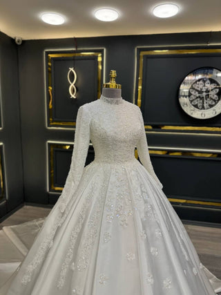 Exquisite High-Neck Wedding Gown with Intricate Floral Beadwork and Long Sleeves