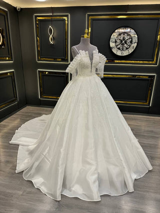 Luxurious Off-the-Shoulder Ball Gown Wedding Dress with Intricate Beading, Dramatic Fringe, and Pleated Bodice