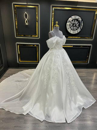 Opulent Off-Shoulder Ball Gown Wedding Dress with Floral Appliques and Dramatic Bow Sleeves